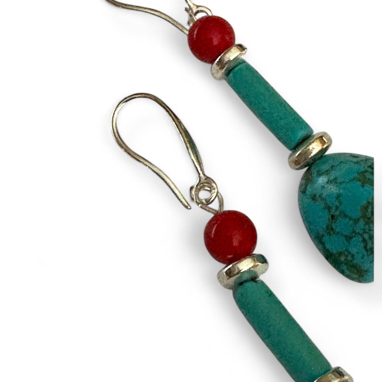 Handmade turquoise and coral gemstone drop earrings with silver ear wire closure. Features natural turquoise teardrop stones paired with round coral   and silver-plated accents. Lightweight boho style dangle earrings, perfect for everyday wear, gifts, or special occasions