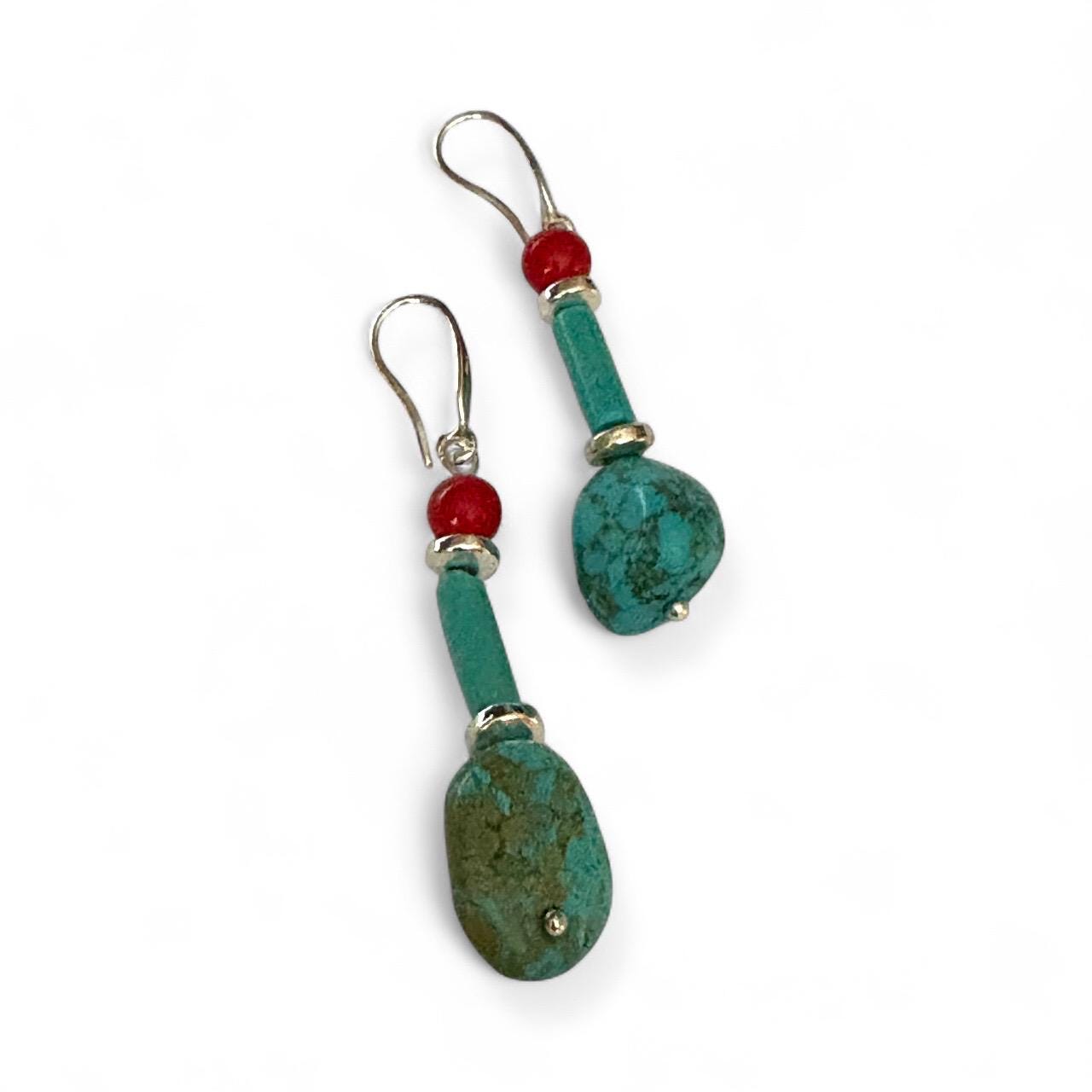 Handmade turquoise and coral gemstone drop earrings with silver ear wire closure. Features natural turquoise teardrop stones paired with round coral   and silver-plated accents. Lightweight boho style dangle earrings, perfect for everyday wear, gifts, or special occasions