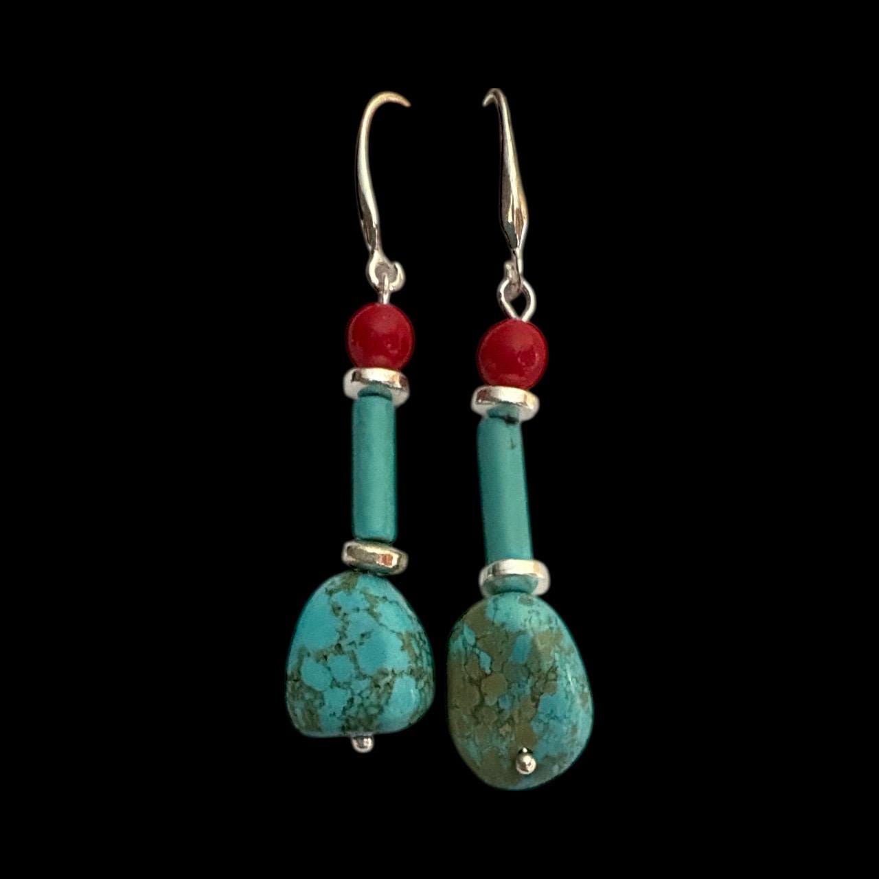 Handmade turquoise and coral gemstone drop earrings with silver ear wire closure. Features natural turquoise teardrop stones paired with round coral   and silver-plated accents. Lightweight boho style dangle earrings, perfect for everyday wear, gifts, or special occasions