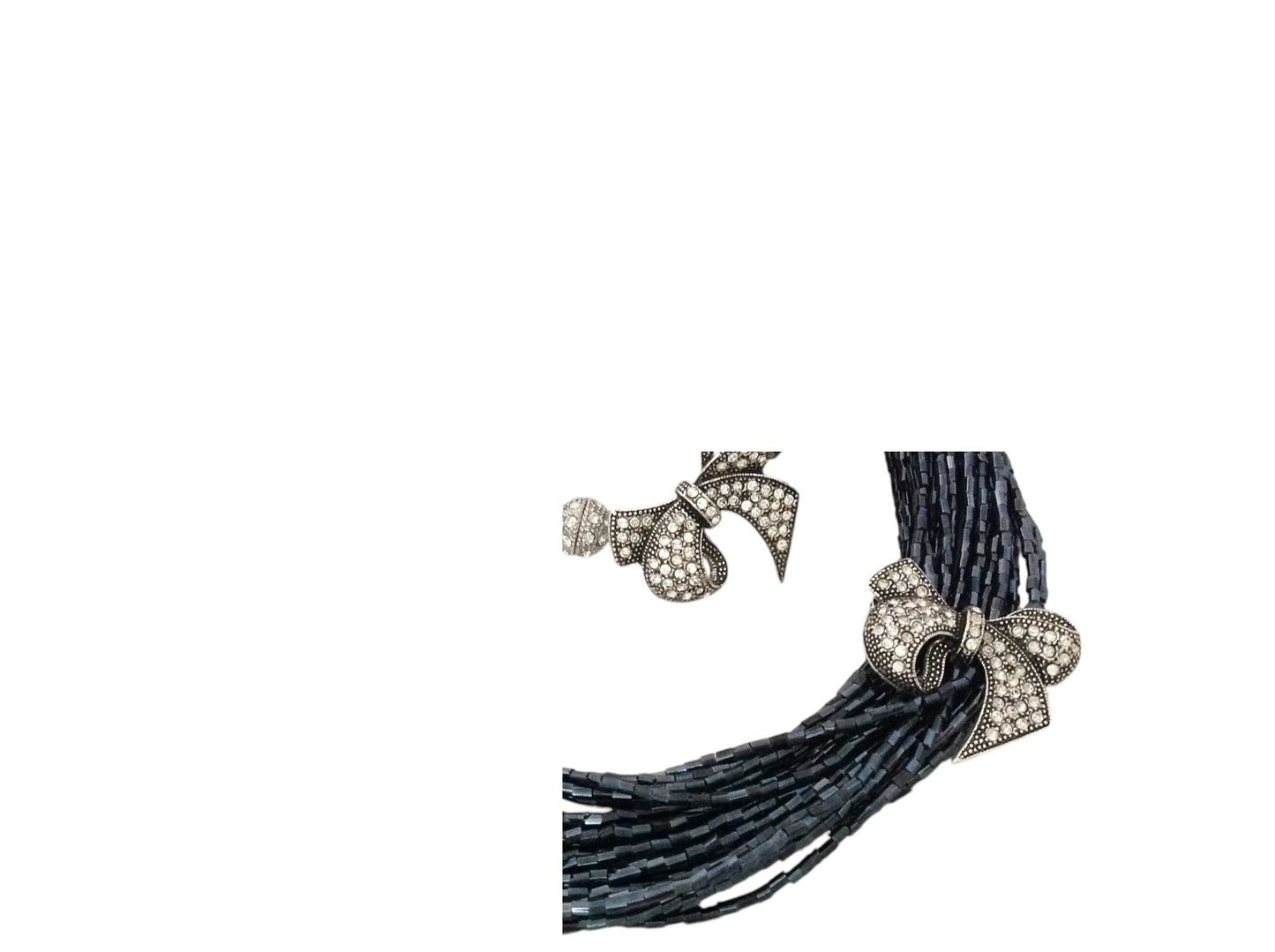 Semra Ascioglu multi-strand midnight-blue glass beaded necklace and bracelet set with crystal-encrusted bow charms.
