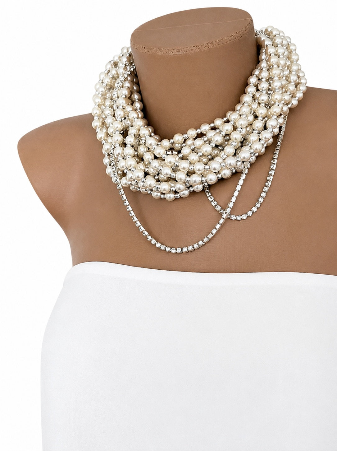 Semra Ascioglu multi-strand pearl statement necklace with sparkling crystal chain accents on a mannequin bust.