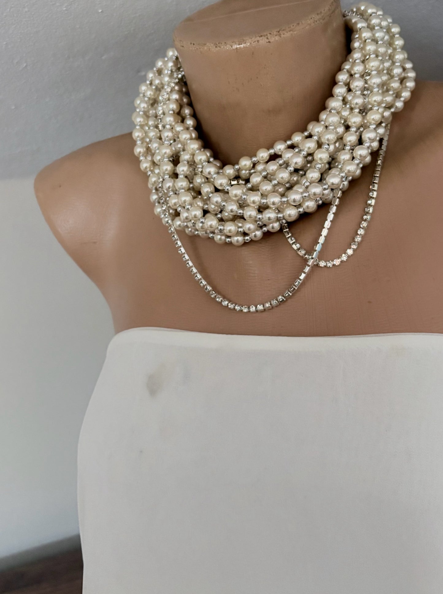 Semra Ascioglu multi-strand statement pearl necklace with sparkling crystal chain accents on a mannequin bust