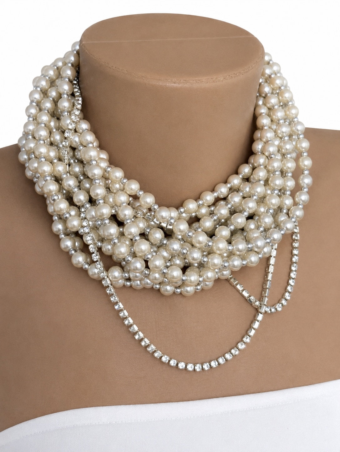 Semra Ascioglu multi strand statement pearl necklace with white pearls and sparkling crystal chain accents on a mannequin