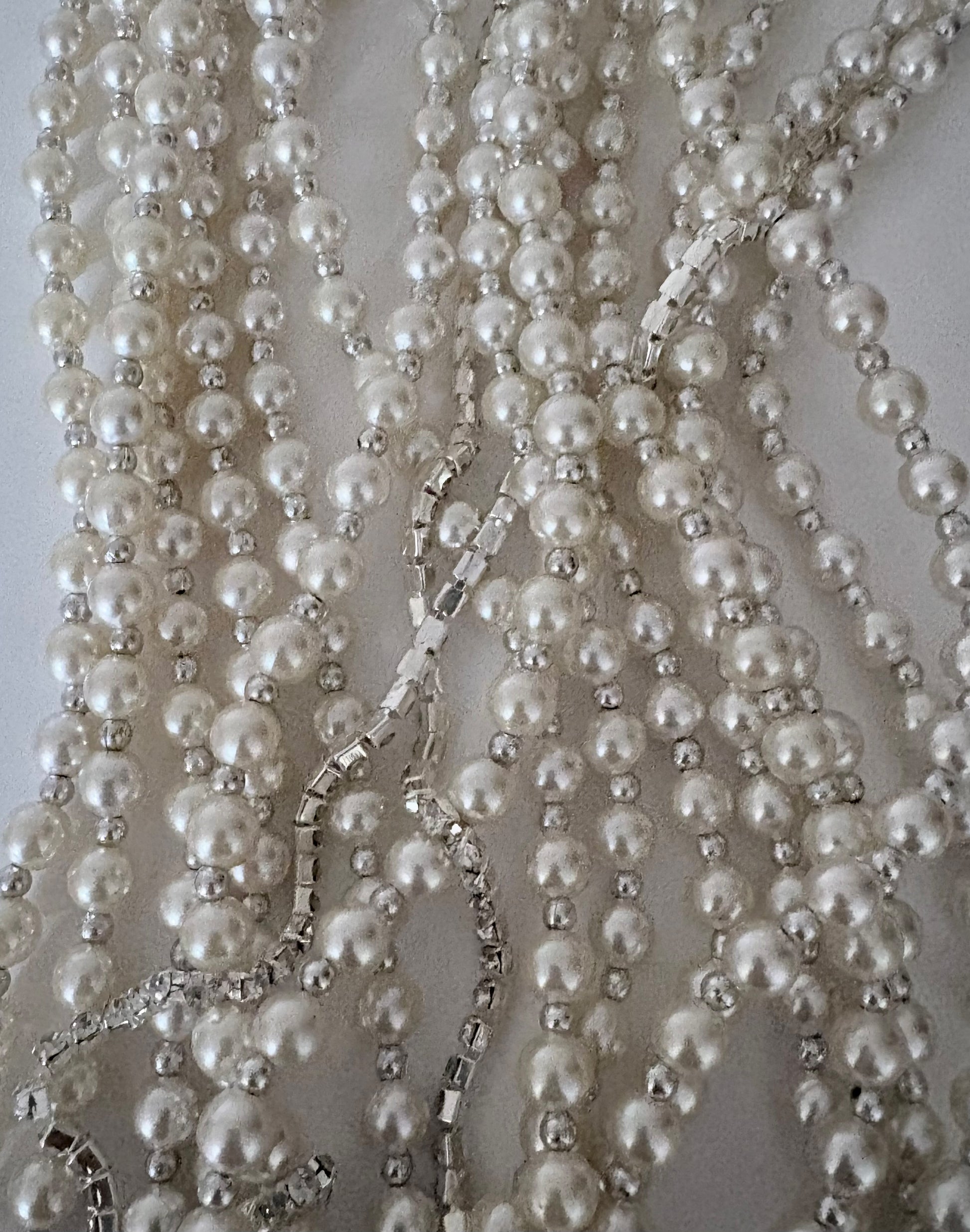 Semra Ascioglu multi-strand pearl statement necklace with shimmering crystal accents for elegant evening wear.